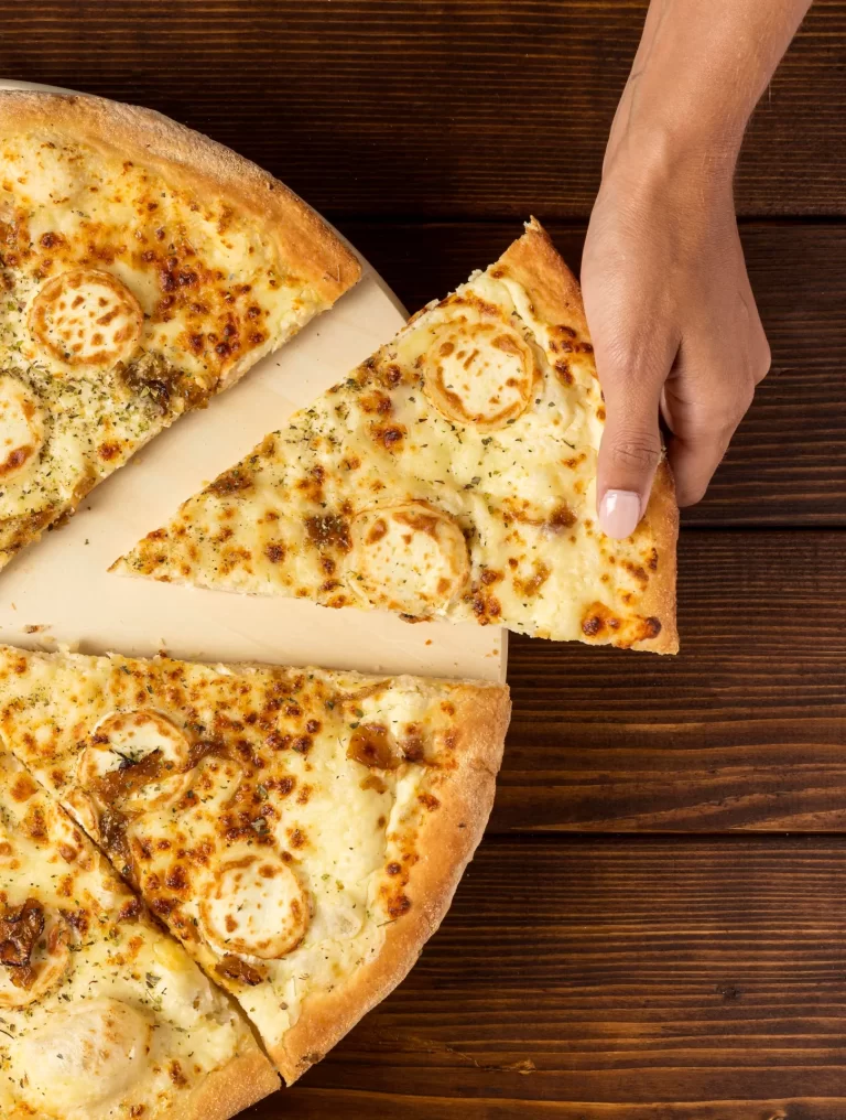 flat-lay-hand-taking-slice-pizza-with-cheese